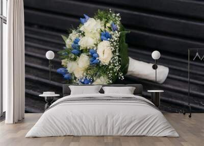 Closeup shot of the bride's bouquet with white and blue flowers Wall mural