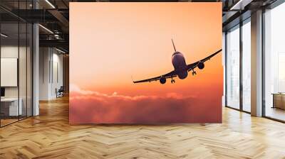 Airplane flying above amazing clouds in clear sunset pink sky. Concept of traveling, vacation and travel by air transport. Beautiful sky background. Copy space. Generative ai Wall mural