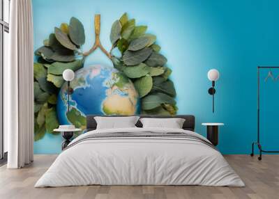 Planet Earth on the background of a lung shaped tree branch Wall mural