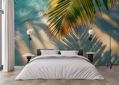 Top view of tropical leaf shadow on water surface. Shadow of palm leaves on white sand beach. Beautiful abstract background concept banner for summer vacation at the beach,goldern hours golden  Wall mural