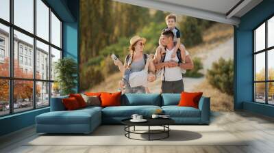 Beautiful family in the mountains. Tourism. Campaign. Fall. Wall mural