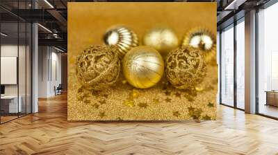 Christmas toys on a gold background. Christmas golden balls. Christmas motives. New Year. Wall mural