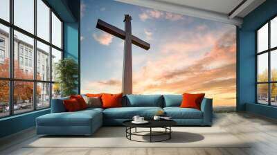 christian easter conceptual religious symbol on a colorful sky at sunset Wall mural