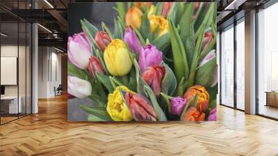 close up bouquet of colorful tulips flower, green leaves, selective focus Wall mural