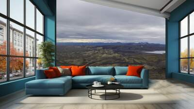 Colorful wide panorama, panoramic view on Volcanic landscape in Lakagigar, Laki Volcano crater chain with green lichens, moss and lakes Kambavatn and Lambavatn, Iceland, moody sky background Wall mural