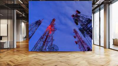 Radio antenna from low angle view operating at night Wall mural