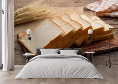 Sliced white bread on wooden board Wall mural