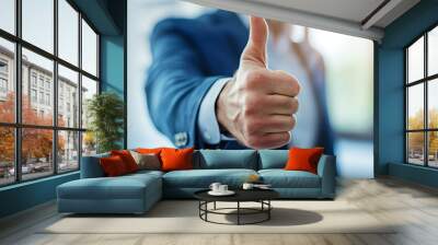 a businessman showing a thumbs-up gesture Wall mural