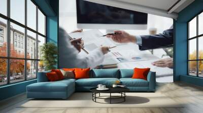 business adviser meeting to analyze and discuss the situation on the financial report in the meeting room.Investment Consultant, Financial advisor and accounting concept Wall mural