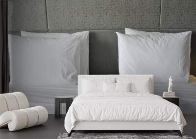 Two comfortable soft pillows on the bed. Close-up white bedding sheets and pillow in room Wall mural