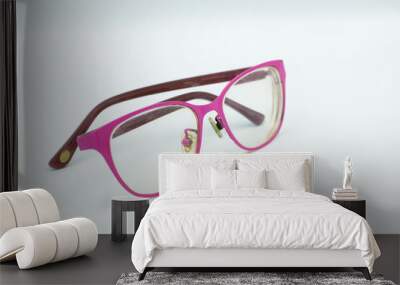 Pink glasses on a white background Wall mural