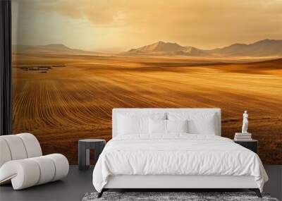 Golden Hour Farmland: Serene landscape photography showcasing vast, sun-drenched farmland under a dramatic sunset sky, rolling hills, and distant mountains. Evokes peace, tranquility. Wall mural