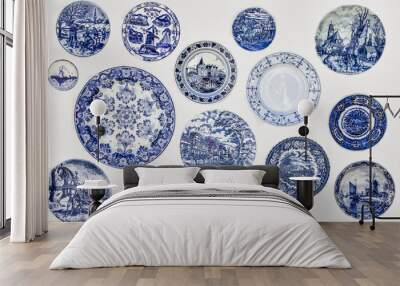 Decorative plates from Holland. Dutch souvenir plates on the wall. Wall mural