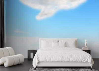 Speech bubble cloud design on blue sky and green field Wall mural