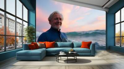 An elderly man wearing a blue wetsuit swimming in the ocean Wall mural