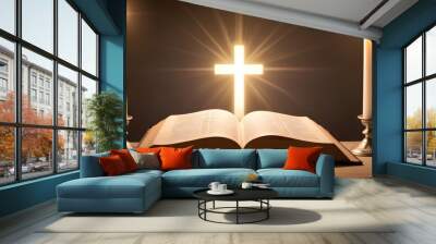 An open isolated bible with a glowing cross in the background, representing Christian faith Wall mural