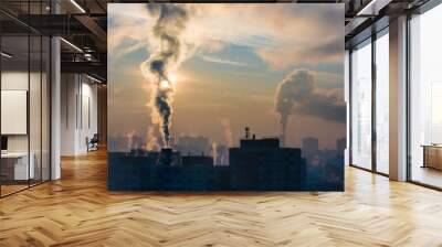 environmental pollution. it is very cold in the morning sunrise in city, smoking chimneys. Wall mural