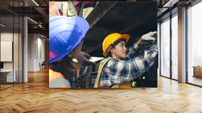 Group of Engineers working on train station garage and using wrench for repair and fix mechanical. Teamwork and successful concept Wall mural