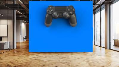 Computer game competition. Gaming concept. Black joystick isolated on blue background, 3D rendering Wall mural