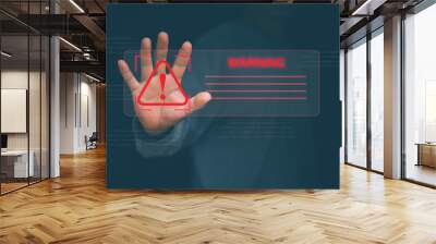 Human hand showing red triangle caution warning sign for maintenance notification error and risk concept. . Wall mural