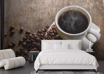 fragrant hot coffee in a white cup with beans spilling roasted c Wall mural