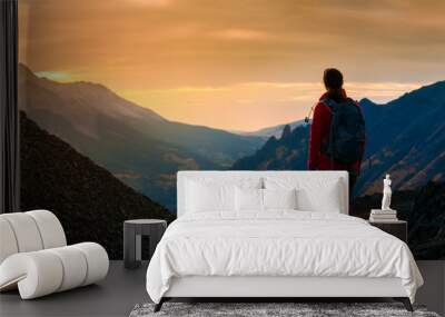 Backpacker Girl Looking at Sunset Colorado Mountains Wall mural