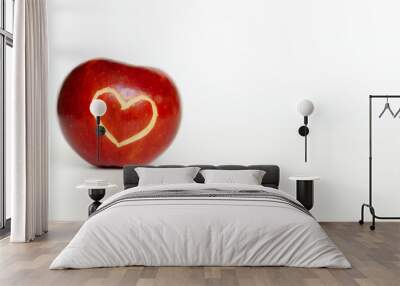 Beautiful bright juicy ripe red apple with a heart shaped cut-out, located on a white background. space for text Wall mural