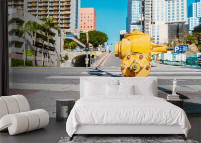 A yellow fire hydrant in the foreground and a panorama of the deserted streets of downtown Los Angeles. Los Angeles, USA - 16 Apr 2021 Wall mural