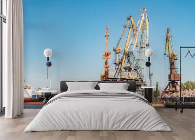 Huge cranes in the port at sea in Kaliningrad. Kaliningrad, Russia - 18 June 2024 Wall mural