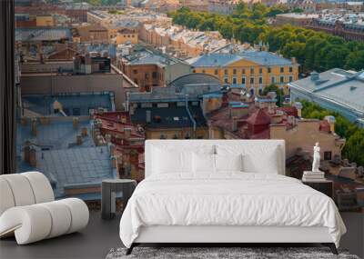 Panoramic view of the city and the beautiful roofs of the city on a sunny day from The colonnade of St. Isaac's Cathedral.. Saint Petersburg, Russia - 26 June 2024 Wall mural