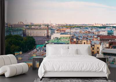 Panoramic view of the city and the beautiful roofs of the city on a sunny day from The colonnade of St. Isaac's Cathedral.. Saint Petersburg, Russia - 26 June 2024 Wall mural