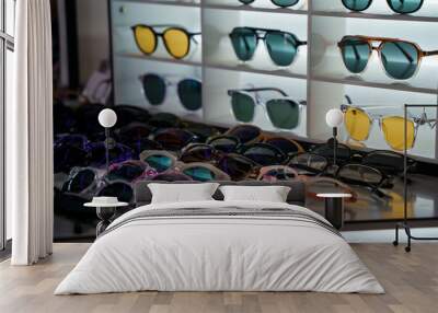 Sunglasses on the counter in optics store. Saint Petersburg, Russia - 24 July 2024 Wall mural