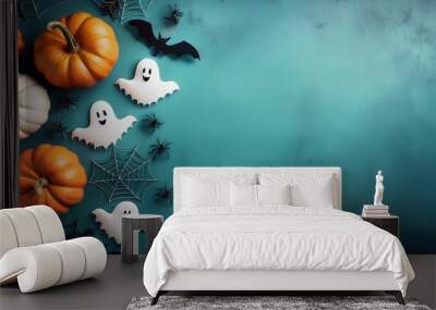 Halloween elements pumpkins, bats, ghosts, spiders on a bright background, with space for text, top view Wall mural