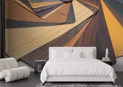 Samples of PVC films of various colors and textures. Material for covering interior doors and platbands. Wall mural