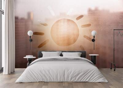 Hand drawn orange shape sun for text on muddy blue glass wet window in city on sunset Wall mural