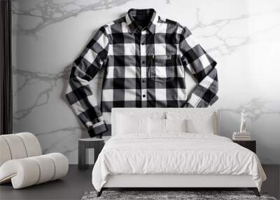 Stylish black and white flannel shirt laid on marble surface for fashion lookbook Wall mural