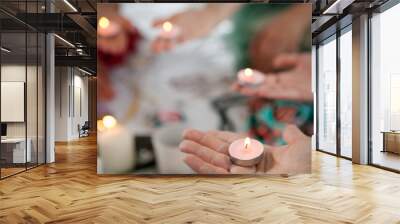 the power of the women's circle, girls hold candles in their hands Wall mural