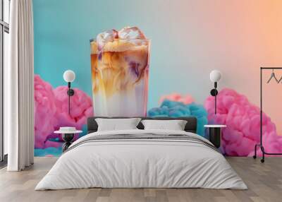 Glass of tasty iced coffee with splashes on color background Wall mural