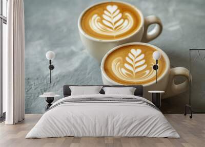 Two cups of cappuccino with latte art on wooden background. place for text. Wall mural