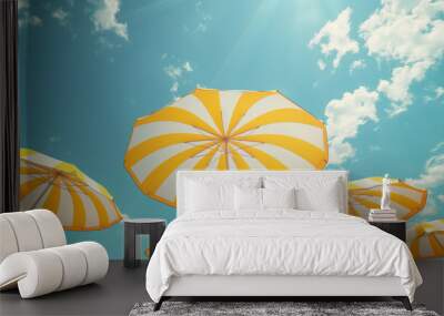 Yellow beach umbrellas on a sunny day. Wall mural