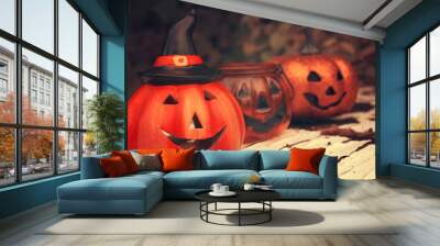 Three funny Halloween pumpkins on wood desk. Autumn mood photo Wall mural