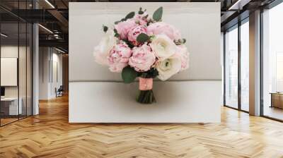 Beautiful wedding bouquet for the bride with pink peonies and white peony roses Wall mural