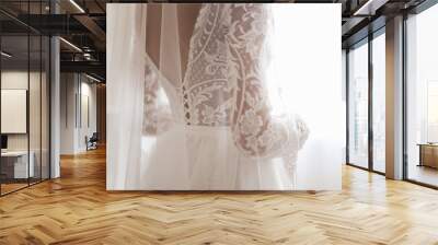 Beautiful Wedding dress and white bow isolated on white background Wall mural