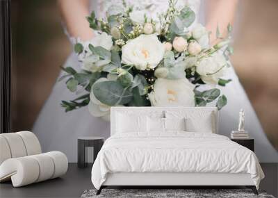 Bridal morning details. Wedding bouquet in the hands of the bride, selectoin focus Wall mural