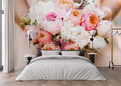 Bridal morning details. Wedding bouquet in the hands of the bride, selectoin focus Wall mural