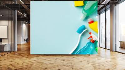 Cleaning concept. Set of cleaning supplies on blue background with copy space, top view Wall mural