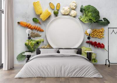 Empty plate with vegetarian food. Fresh ingredients for cooking vegan  plate top view Wall mural