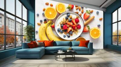 Healthy breakfast bowl with ingredients granola fruits Greek yogurt and berries on white marble table top view. Weight loss, healthy lifestyle and eating concept Wall mural