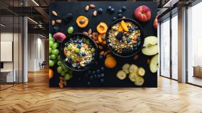 Two healthy breakfast bowl with ingredients granola fruits Greek yogurt and various berries on dark background top view. Weight loss, healthy lifestyle and eating concept Wall mural