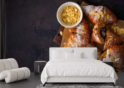 Vegan croissants with almond flakes and icing sugar top view Wall mural